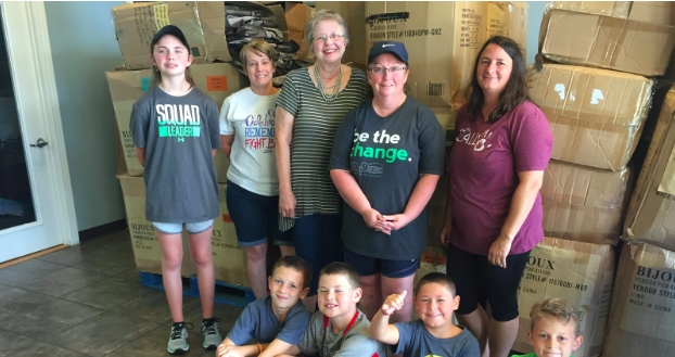 Connie Brown, top center, volunteers regularly with the Samaritan Center, a “grace-driven nonprofit organization with a mission to serve the hurting and hungry of Northwest Arkansas with dignity and compassion on a regular basis."